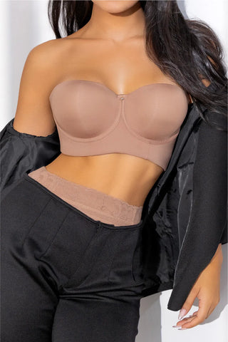 Woman wearing strapless push-up bra shapewear in nude beige