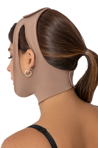 Back view of a woman wearing the Post-Surgery Facial Compression Band compression garment by Jackie London